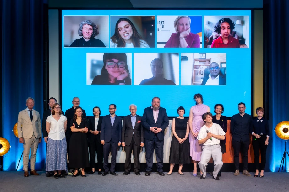 Erase Indifference Challenge award ceremony with jury and mentors on stage